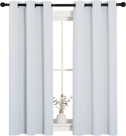 NICETOWN Halloween Pitch Black Solid Thermal Insulated Grommet Blackout Curtains/Drapes for Bedroom Window (2 Panels, 42 inches Wide by 63 inches Long, Black) - Colors A