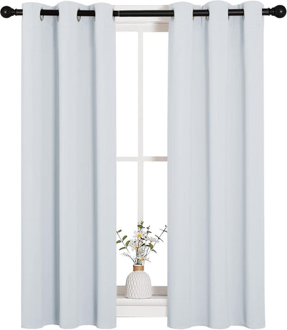 NICETOWN Halloween Pitch Black Solid Thermal Insulated Grommet Blackout Curtains/Drapes for Bedroom Window (2 Panels, 42 inches Wide by 63 inches Long, Black) - Colors A