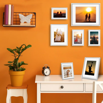Frametory, Black Aluminum Picture Frame with Removable Mat - Set of 7 Includes Four 5x7, Two 8x10, One 11x14 - Real Glass Front - Simple Gallery Wall Frames for Art Prints and Posters