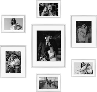 Frametory, Black Aluminum Picture Frame with Removable Mat - Set of 7 Includes Four 5x7, Two 8x10, One 11x14 - Real Glass Front - Simple Gallery Wall Frames for Art Prints and Posters