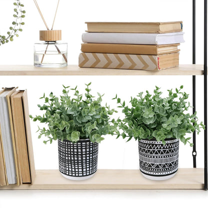 Winlyn Set of 2 Small Artificial Potted Plants Faux Eucalyptus Plant in White Geometric Ceramic Pots Small Desk Potted Plants 7.1" Tall for Home Office Room Decorations Wedding Greenery Centerpiece