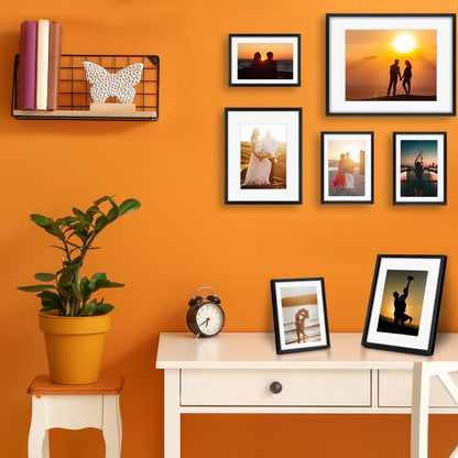 Frametory, Black Aluminum Picture Frame with Removable Mat - Set of 7 Includes Four 5x7, Two 8x10, One 11x14 - Real Glass Front - Simple Gallery Wall Frames for Art Prints and Posters