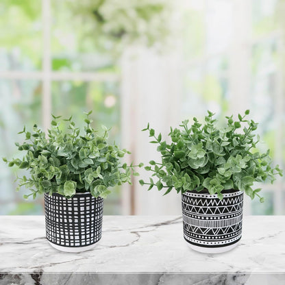 Winlyn Set of 2 Small Artificial Potted Plants Faux Eucalyptus Plant in White Geometric Ceramic Pots Small Desk Potted Plants 7.1" Tall for Home Office Room Decorations Wedding Greenery Centerpiece