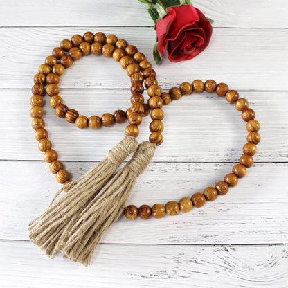 CVHOMEDECO. Wood Beads Garland with Tassels Farmhouse Rustic Wooden Prayer Bead String Wall Hanging Accent for Home Festival Decor. Mix Distressed