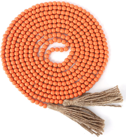 CVHOMEDECO. 16 Feet Wood Beads Garland with Tassels Farmhouse Rustic Wooden Decorative Bead String Wall Hanging Accent for Home Festival Decor. Orange