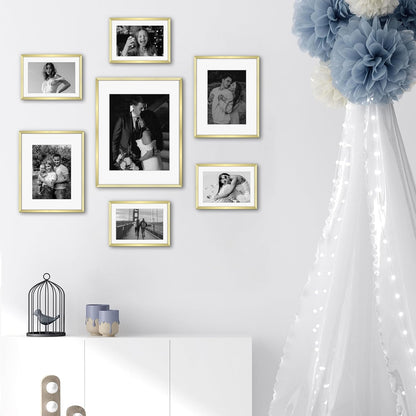 Frametory, Black Aluminum Picture Frame with Removable Mat - Set of 7 Includes Four 5x7, Two 8x10, One 11x14 - Real Glass Front - Simple Gallery Wall Frames for Art Prints and Posters