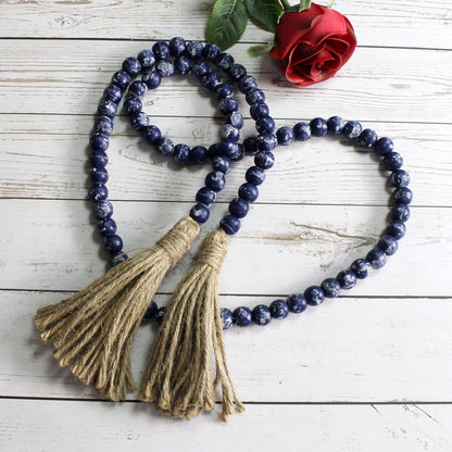 CVHOMEDECO. Wood Beads Garland with Tassels Farmhouse Rustic Wooden Prayer Bead String Wall Hanging Accent for Home Festival Decor. Mix Distressed