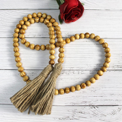 CVHOMEDECO. Wood Beads Garland with Tassels Farmhouse Rustic Wooden Prayer Bead String Wall Hanging Accent for Home Festival Decor. Mix Distressed