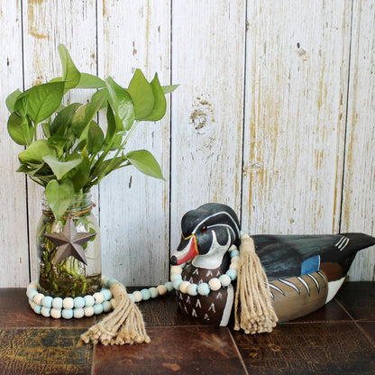 CVHOMEDECO. Wood Beads Garland with Tassels Farmhouse Rustic Wooden Prayer Bead String Wall Hanging Accent for Home Festival Decor. Mix Distressed