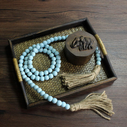 CVHOMEDECO. Wood Beads Garland with Tassels Farmhouse Rustic Wooden Prayer Bead String Wall Hanging Accent for Home Festival Decor. Mix Distressed